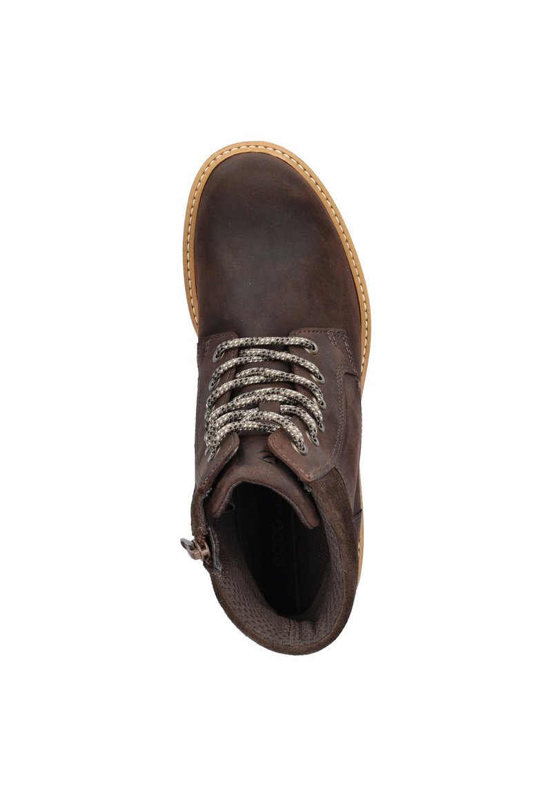 Bota de cuero marrón con punta redonda, cordones plateados y suela marrón claro. Presenta una textura suave y una cremallera lateral para facilitar su puesta.