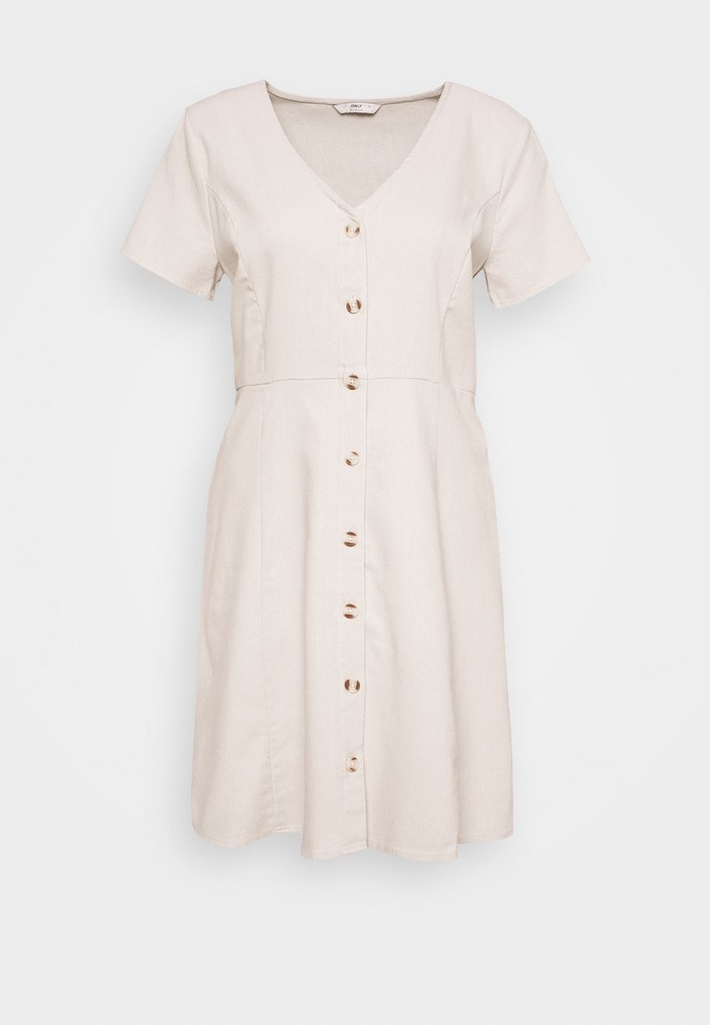 Lyhythihainen, v-pääntie mekko vaaleasta beige kankaasta, jossa on nappikiinnitys puun appeilla ja levenevä muoto. Silkkinen pinta.