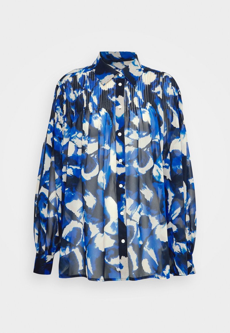 Blusa a maniche lunghe con motivo floreale blu e bianco. Realizzata in tessuto leggero con un design plissettato e chiusura a bottoni sul davanti.