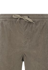Buks i kordfl�øjl i afdæmpet brun; har en tekstureret overflade med lodrette striber og en elastisk talje med en bundet snore-detalje.
