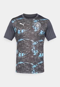 Short-sleeve jersey in gray with black and blue abstract patterns, featuring a Puma logo and Manchester City emblem on the chest.