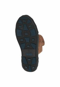 Semelle de boot en cuir marron avec une base en caoutchouc noir texturé. Présente des coussinets de grip bleus et des motifs ovales fluides pour l'adhérence.