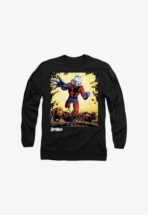 Black long-sleeve shirt featuring a comic design of Ant-Man in a red and blue suit, surrounded by large brown ants against a yellow background.