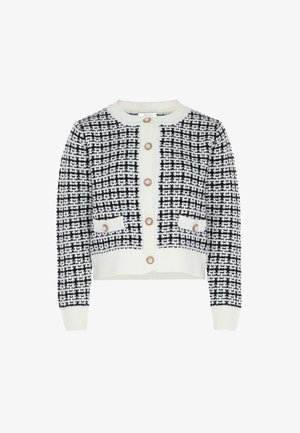 Fekete-fehér tweed kardigán kerek gallérral, hat arany színű gombbal, valamint két elülső zsebbel, bordázott mandzsettákkal és lefelé keskenyedő szegéllyel.