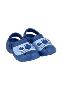 Blue clogs made of rubber with a character design featuring large eyes and a rounded nose, textured surface, and a secure heel strap.