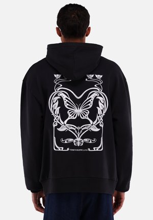 Zwarte hoodie met een groot wit vlinder- en bloemenontwerp op de achterkant. Voorzien van een trekkoordcapuchon en geribde manchetten. Casual fit.