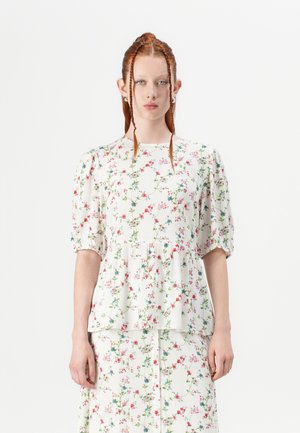 Floraler Peplum-Top aus leichtem Stoff, mit kurzen Puffärmeln und einem weißen Hintergrund mit bunten Blumenmustern.