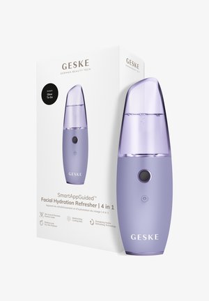 Dispositif rafraîchissant d'hydratation du visage à la lavande avec dessus transparent, bouton rond, présenté à côté d'une boîte blanche avec détails du produit et branding.