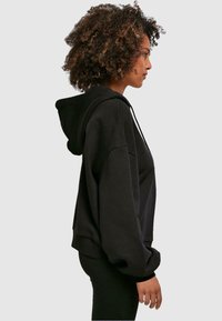 Merchcode IT´S YOUR TIME TO BLOOM - Hoodie - black