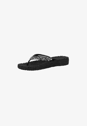 Black flip-flop sandal with woven texture, featuring two slender straps with shiny accents. The sole is flat and made of rubber.