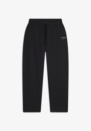 Un pantalon de jogging noir en tissu doux, doté d'une taille élastique avec un cordon de serrage, de poches latérales et d'un logo sur la cuisse gauche.