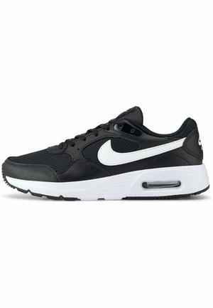 Schwarze Sportschuhe mit Obermaterial aus Mesh und Leder, ausgestattet mit einem weißen Nike-Swoosh, einem gepolsterten Schaft und einer kontrastierenden weißen Zwischensohle mit Air-Dämpfung.