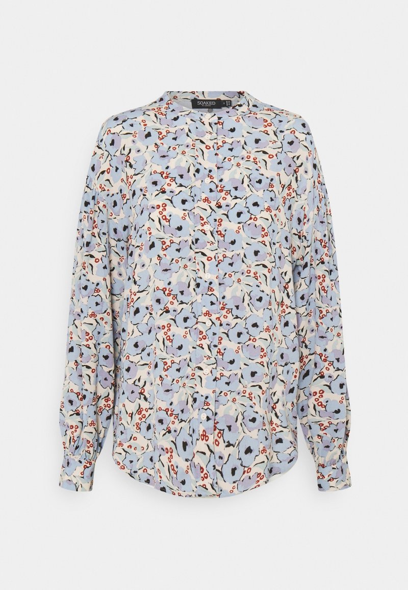 Bluzka z długim rękawem z lekkiego materiału, z jasnoniebieskim tłem i kwiatowymi printami w kolorach purpury, czerwieni i czerni. Zapięcie na guziki i fałdy.