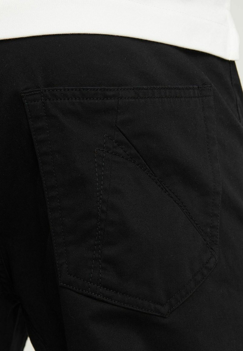 CHASIN' RESA L MAGNUS - Pantalones - black/negro - Zalando.es