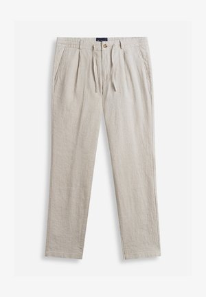 Pantalon beige en lin avec plis sur le devant, poches latérales, fermeture par bouton et cordon de serrage, et passants pour ceinture, présenté à plat sur un fond blanc.