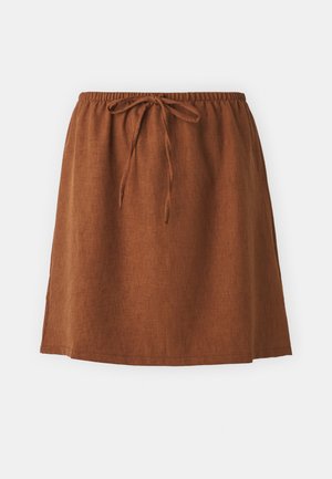 Brown linen skirt with an elastic waistband and tie detail. Features a relaxed fit and hem that falls above the knee.