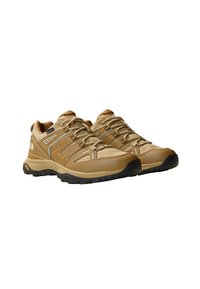 Lette, brune tursko med mesh- og syntetisk materiale, fremtredende snøresystem, teksturert såle og Vibram såle.
