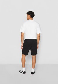 Urban Classics Tracksuit bottoms - black