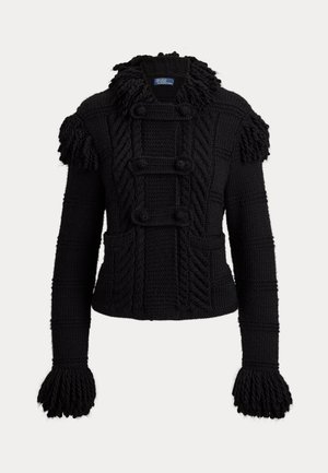 Veste noire en maille torsadée avec des détails pompons sur les épaules, les poignets et le col, avec un col montant et des pans avant boutonnés.