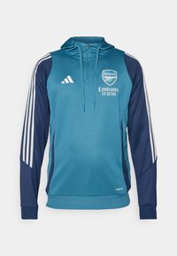 Teal and navy hooded sweatshirt with white Adidas stripes, logo, and "Emirates Fly Better" text. Soft fabric, athletic fit, and zipper.
