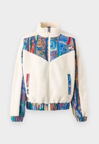 Fleece jacket featuring a cream color body with vibrant patterned sleeves in blue, red, and green, zip closure, and elastic cuffs and hem.