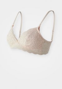 Mežģīņu bralette gaiši persiku un krēmkrāsā ar viļņotām malām. Regulējami siksniņas un ziedu raksts. Mīksta auduma ar delikātu tekstūru.