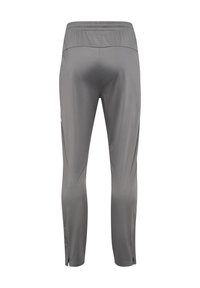 Graue Sporthose im Slim-Fit-Stil, mit elastischem Bund und seitlichen Schlitzen an den Säumen; aus leichtem, glattem Material gefertigt.