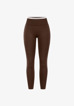 Leggings marrones de cintura alta, sin costuras, con una cinturilla acanalada que presenta un pequeño detalle de logo en blanco.