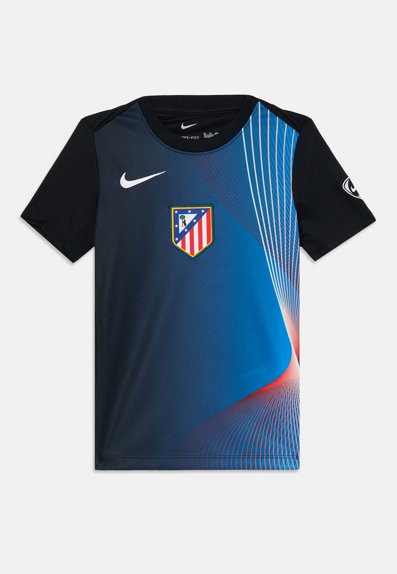 Camiseta de manga corta de Nike con un patrón de degradado azul, mangas negras y un logo del escudo del Atlético de Madrid en el frente. Textura suave.