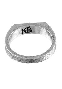 Silver ring with a textured, matte finish. Features a hexagonal top and engraved logo inside. Smooth interior for comfort.