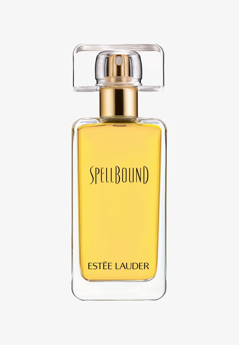 Flacon de parfum en verre transparent de forme rectangulaire, avec des accents dorés, un liquide jaune, et le texte "SPELLBOUND" et "ESTEE LAUDER" imprimé à l'avant.