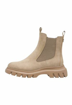 Bottines Chelsea en daim beige avec des panneaux élastiques sur les côtés, une semelle en caoutchouc épaisse et des languettes de traction pour un enfilage facile. Texture lisse avec des détails cousus.