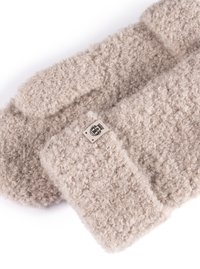 Beige knitted gloves featuring a textured, fluffy material. Includes a small logo patch for branding.