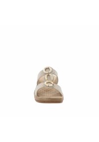 Infradito beige con toma sintetica, tre decorazioni circolari, design open-toe e soletta forata per la traspirabilità.