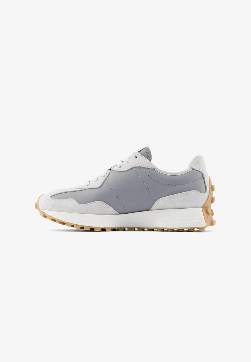 Gray and white athletic shoe featuring suede and leather materials, textured tread sole, and a smooth design with minimal branding.