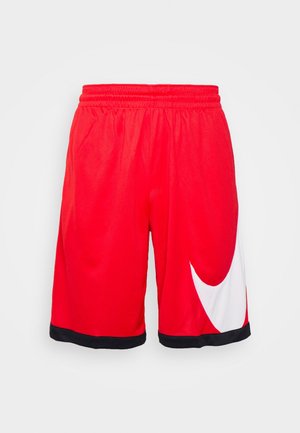 Shorts de sport rouges en tissu léger, avec un motif swoosh blanc et une bordure noire le long de la ceinture et des ourlets.
