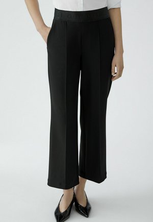 NEYA - Stoffhose - black