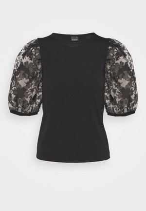 Black short-sleeve top with sheer puff sleeves featuring a floral lace pattern and solid fitted body.