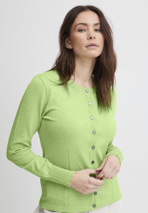 Hele roheline cardigan, mis on valmistatud pehmest kangast, koos nuppudega eest, hõbedaste nuppudega, pikkade varrukatega ja külgõmblustega, millel on peene tikandi detail.