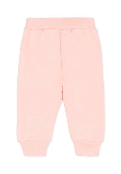 Pantalon de jogging rose clair en tissu doux, avec une taille et des poignets côtelés, un design simple sans motifs supplémentaires.