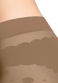 Collant color nude con una texture liscia e trasparente, dotati di un ampio elastico in vita. Il tessuto sembra leggermente strutturato con un design gradiente.