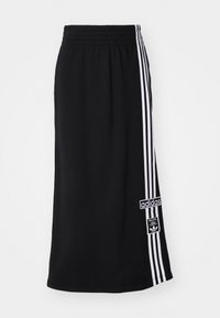 Fekete sport szoknya, rugalmas derékkal, ami egy oldalán három fehér csíkkal és az Adidas logóval díszített. Simább anyagú textúra.
