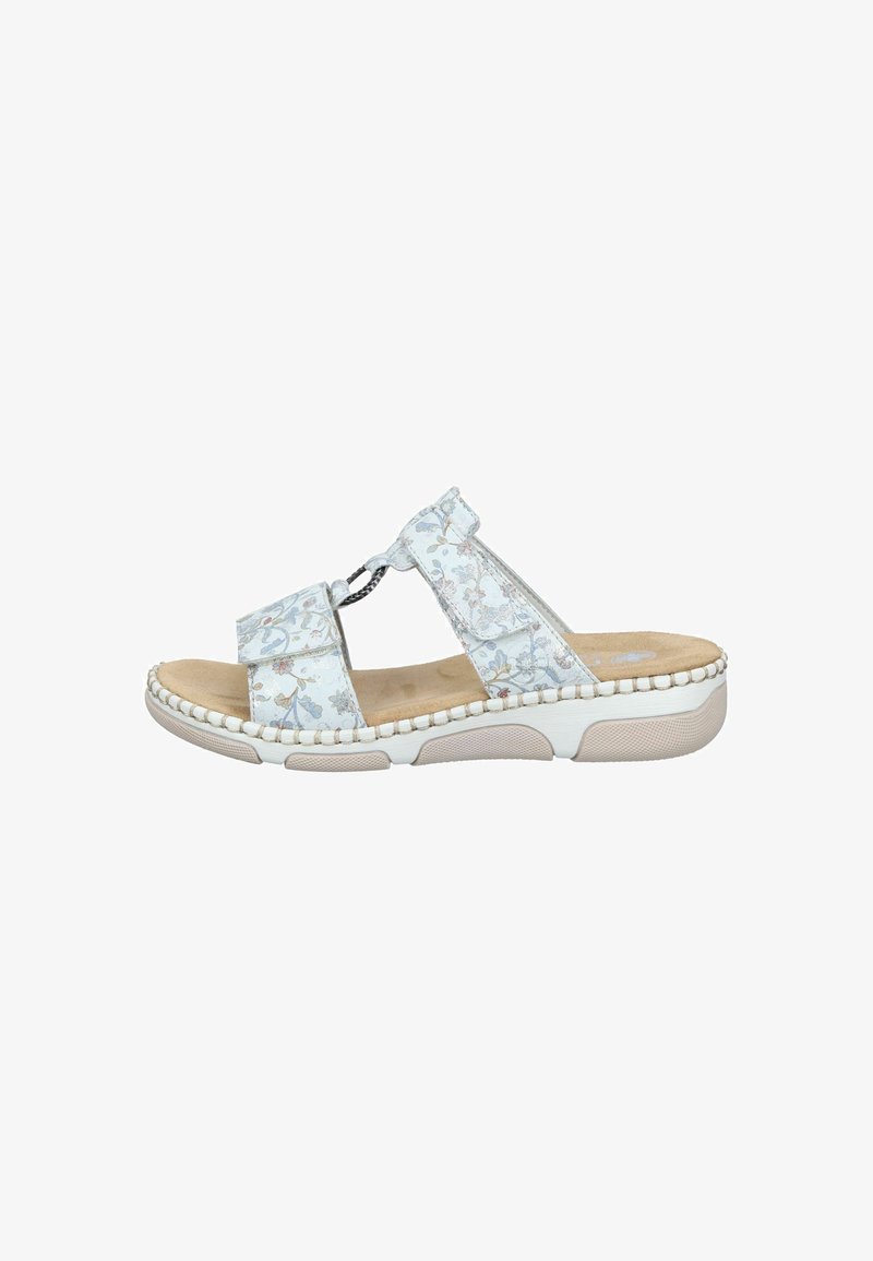Sandale blanche à enfiler avec motif floral, deux brides réglables, semelle rembourrée et semelle extérieure beige texturée pour un usage décontracté.