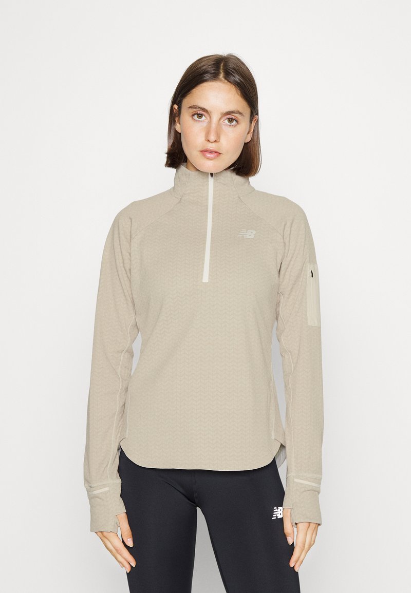 New Balance HEAT GRID HALF ZIP Fleece trui sea salt heather/crème
