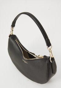 Black leather handbag with a textured finish, curved shape, gold hardware, and a zip closure. Features a short, padded shoulder strap.