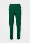 ICONS CUFF PANTS LOGO - Pantalones deportivos - dark green