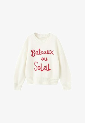 Pull en tricot blanc avec poignets et ourlet côtelés, portant le texte rouge "Bateaux au Soleil" sur le devant.