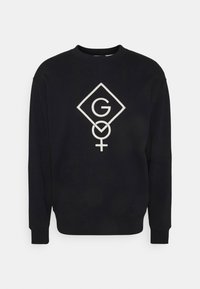 Černá mikina s centrálním bílým grafikou s písmenem "G" a ženským symbolem uvnitř diamantového tvaru. Klasický kulatý výstřih.