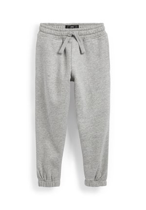 Pantalon de jogging gris clair à coupe ample avec taille élastique, cordon de serrage, poches latérales et poignets élastiques aux chevilles.