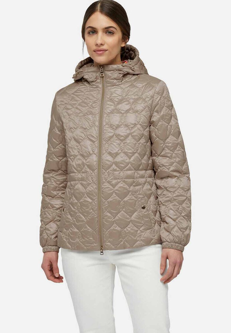 Lichtbeige gewatteerde jas met een capuchon, voorritssluiting en elastische manchetten. Heeft een ruitpatroon en een ingetogen ontwerp voor warmte.